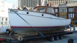 A beautiful  wooden Colvic boat being towed from Plymouth to Portland